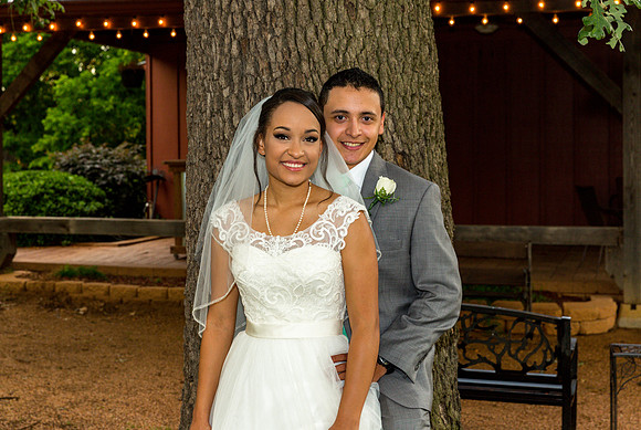 Bride and groom pose for a night shot